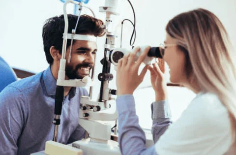 A man has an eye exam at Mission Eye Care Centre for Dry Eye Disease and Corneal Disease